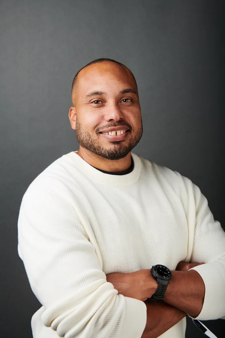 Robin Hill — studio headshot of the creator behind @robinweb3, smiling in a cream sweater